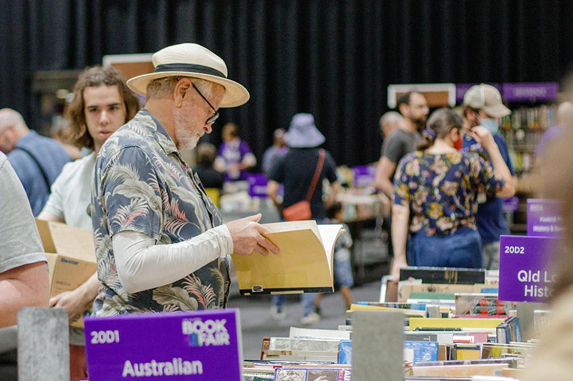 A man browses through a book at the book fair