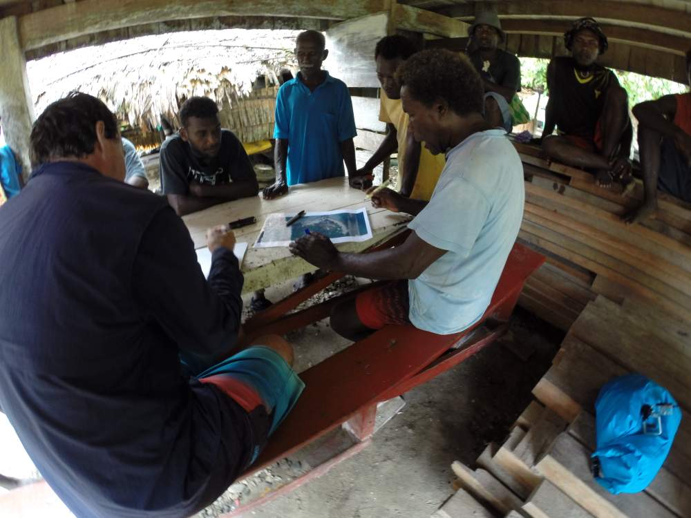 Dr Albert and Nuatambu locals examine satellite images and compare them with local knowledge and traditional assessments.