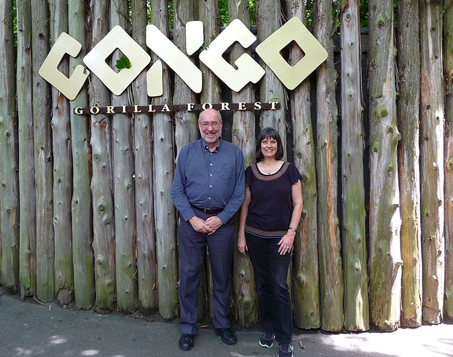 Professor Roy Ballantyne and Associate Professor Jan Packer standing in front of the sign 'Congo' at the Bronx Zoo’s Congo Gorilla Forest.