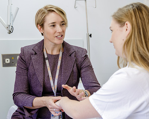 Practitioner consulting with patient