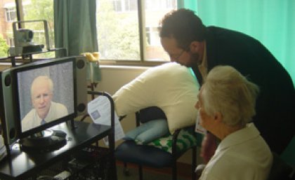 UQ’s Professor Len Gray consults with a patient using telehealth.