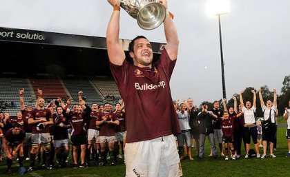 UQ Captain James Hanson holds up the Hospital Cup. Photo by Tomme Hanson