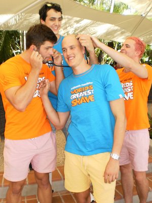 Team Maunder gets ready to "be brave and shave" in front of crowds at Regatta Hotel to raise funds for the World’s Greatest Shave campaign. (Left in orange, Kane Boucaut, back in blue, Louis Stephen, middle in blue John Maunder and right in orange Mac Alison.) Photo by Kate Bishop.