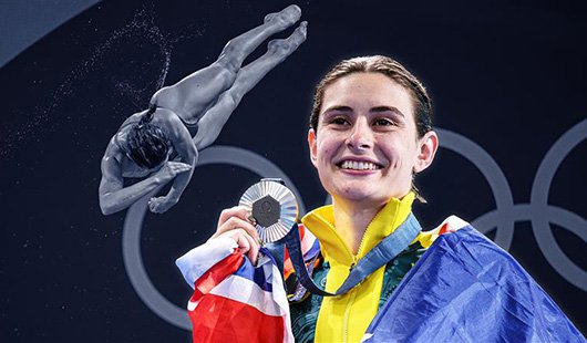 Maddison Keeney holding a silver Olympic medal and smiling with an Australian flag around her shoulders