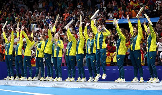 The Australian women's water polo team celebrate after winning a silver medal in Paris