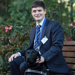 Associate Professor Paul Harpur and his guide dog, Chester