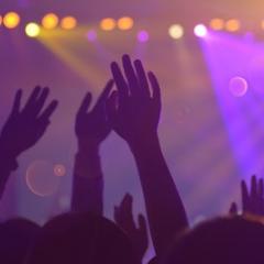 Hands raised during a concert.